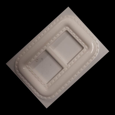 Fibbia rettangolare in plastica con finta trapuntatura h cm 4,5 l cm 6,5
